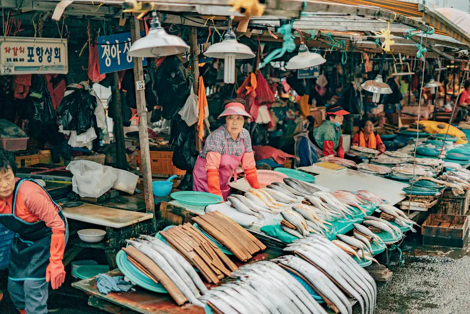 Fish sellers at their stalls — Jagalchi Market, Busan