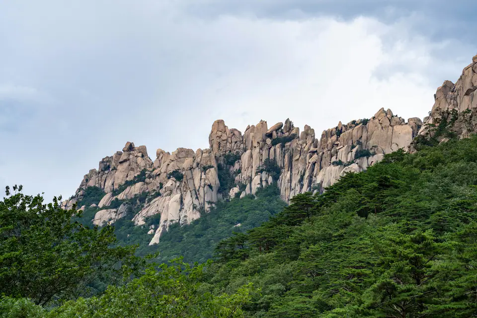 Granite outcrops on a green mountainside — Seoraksan